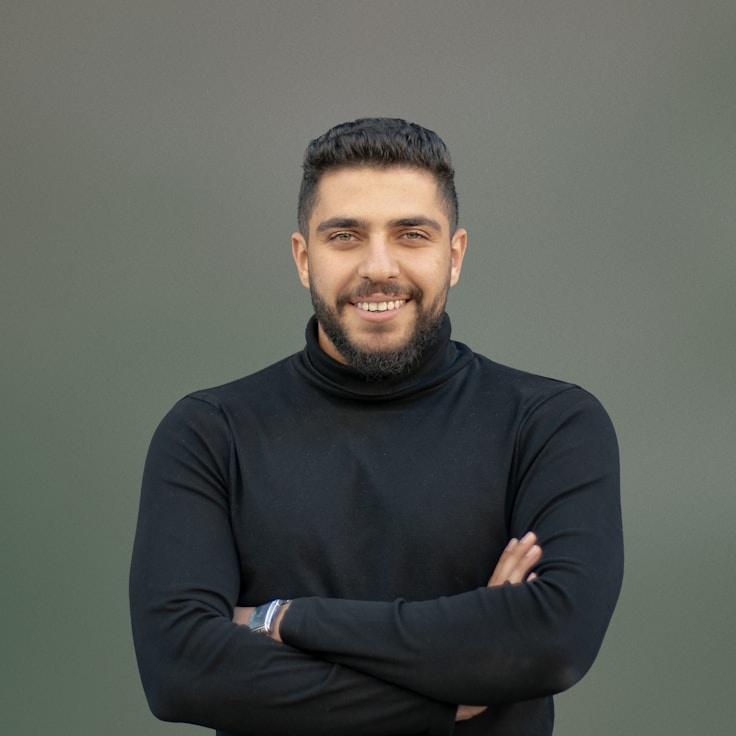 Kaveri Mehta, Lead Design Curator at Cinder Path Works, reviewing corporate floral arrangements